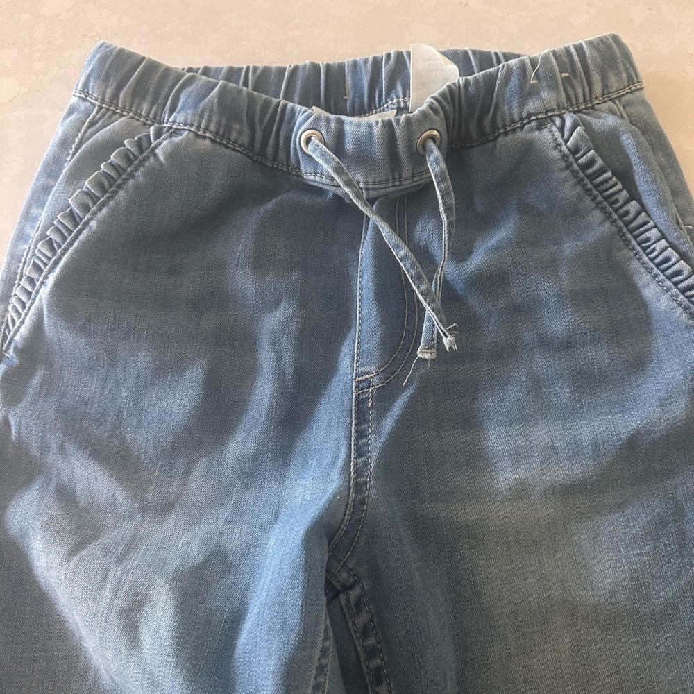 H&M size 7 super stretch joggers with sweet ruffle details.
